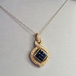 18k sapphire & diamond necklace! The chain is 10k and 20 inches long. The pendan